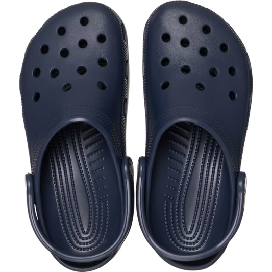 Navy blue clogs with a clear background
