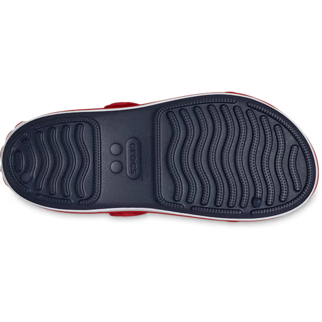 Close-up of a shoe sole with a brand logo on a white background