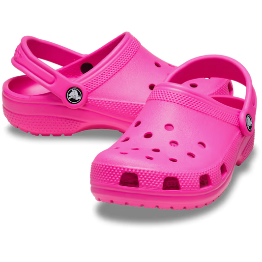 Pair of bright pink clogs on a white background