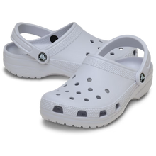 Load image into Gallery viewer, Pair of light blue clogs on a transparent background