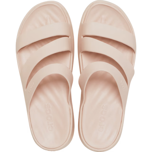 Pair of light pink sandals on a white background
