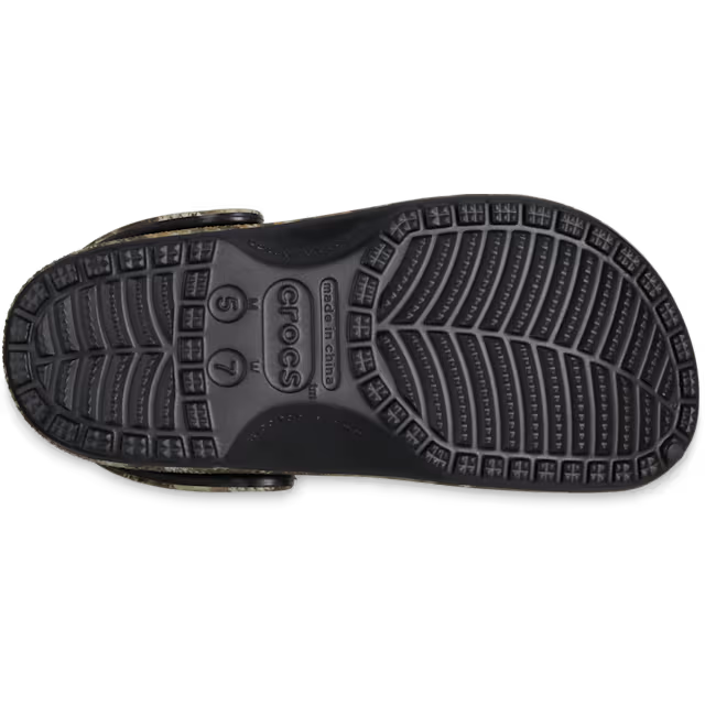 Black sandal sole with Crocs branding on a white background