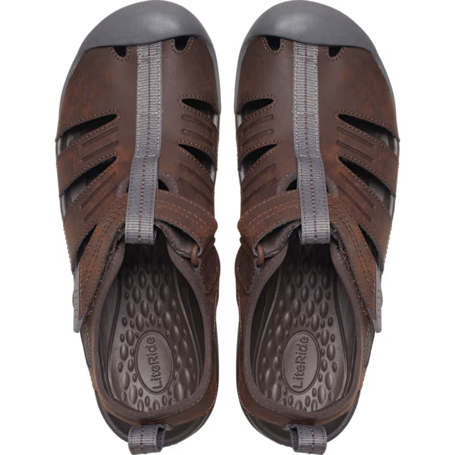 Pair of brown sandals with gray soles on a white background