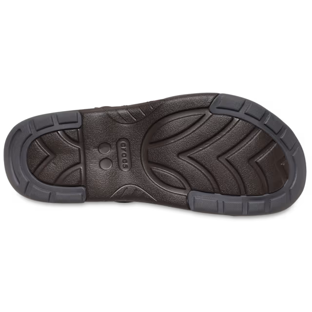 Dark brown shoe sole with visible brand logo on a white background