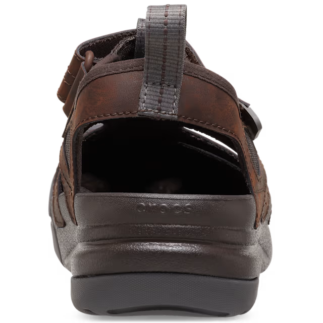Brown sandal with gray sole on a white background