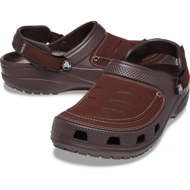 Brown sandals with a visible brand logo on a transparent background