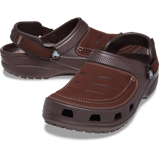 Brown sandals with a visible brand logo on a transparent background