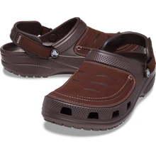 Load image into Gallery viewer, Brown sandals with a visible brand logo on a transparent background