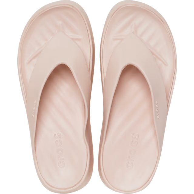 Pair of light pink slides on a white background