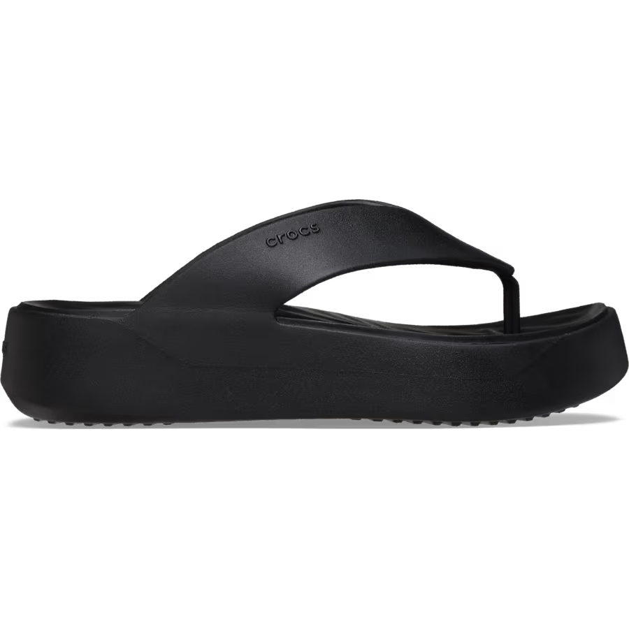 Black sandal with 'Crocs' branding on a white background