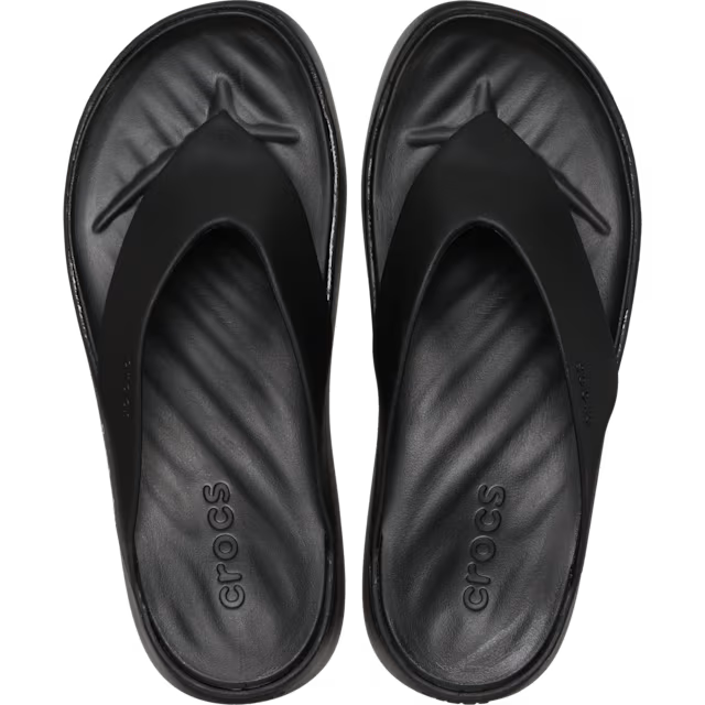 Black Crocs sandals on a white background
